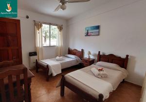 A bed or beds in a room at Nuevo Hotel Aguada del Zorro