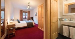 Postel nebo postele na pokoji v ubytování Chalet Taja + 2 fotografie