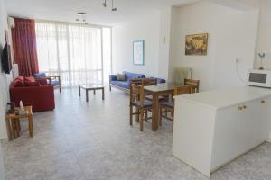 A kitchen or kitchenette at Sunny Apartment