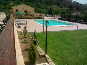 a street light next to a swimming pool at Patitiri in Santa Teresa di Riva