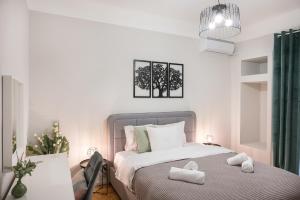 מיטה או מיטות בחדר ב-Porto Sea View Apartments - Kypriou
