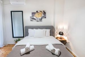 Postel nebo postele na pokoji v ubytování Porto Sea View Apartments - Kypriou