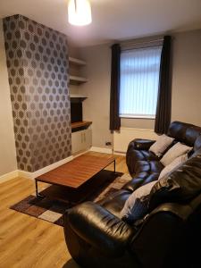 A seating area at 24 Dryden Road - Beautiful 2 bed