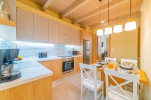 a kitchen with a table and chairs in a room at Anatoli Residence in Rethymno