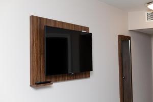 a flat screen tv hanging on a wall at Sweet Chestnut, Dunfermline by Marston's Inns in Dunfermline