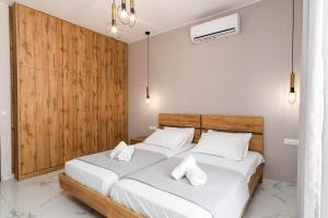 Posteľ alebo postele v izbe v ubytovaní Villa Karouzo - With Private Pool + 28 fotografií