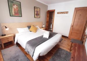 Posteľ alebo postele v izbe v ubytovaní Hostal Fonda Prat