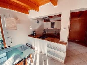 a kitchen with a table and a counter top at Żywiecka Przystań in Żywiec