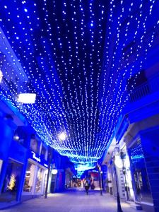 a building with blue lights hanging from the ceiling at Exantas the Lux-Veria in Veria