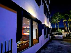 a building with a window with a car in it at Golden Court Hotel - Sri Pelangi in Johor Bahru
