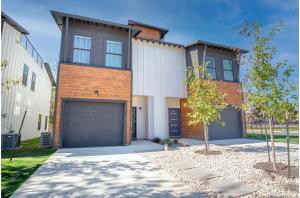 a house with a garage in front of it at Spectacular 3 BR plus 2 and a half BA Apt Near Downtown in San Antonio