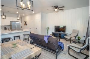 a living room with a couch and a table at Spectacular 3 BR plus 2 and a half BA Apt Near Downtown in San Antonio