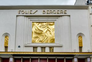a gold window on the side of a building at Pavillon Opéra Grands Boulevards in Paris