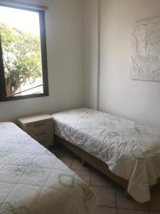 Katil atau katil-katil dalam bilik di BEIRA DA PRAIA com VISTA TOTAL DO MAR