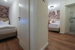 Postel nebo postele na pokoji v ubytování Altstadthotel Zur Börse