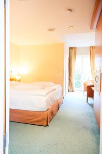 Postel nebo postele na pokoji v ubytování Hotel Landhaus an de Dün