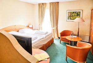 Postel nebo postele na pokoji v ubytování Hotel Landhaus an de Dün
