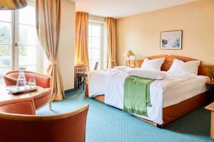 Postel nebo postele na pokoji v ubytování Hotel Landhaus an de Dün + 37 fotografií