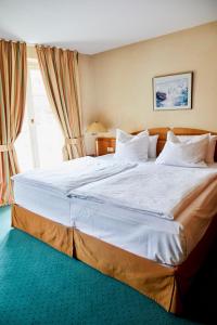 Postel nebo postele na pokoji v ubytování Hotel Landhaus an de Dün