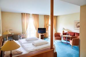 Postel nebo postele na pokoji v ubytování Hotel Landhaus an de Dün