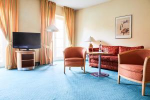 TV a/nebo společenská místnost v ubytování Hotel Landhaus an de Dün