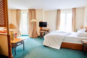 Postel nebo postele na pokoji v ubytování Hotel Landhaus an de Dün