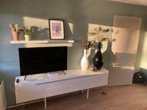 Een TV en/of entertainmentcenter bij Sea la vie
