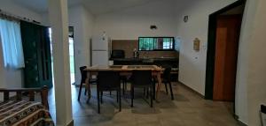a kitchen and dining room with a table and chairs at Villa Elena Icho Cruz in Villa Icho Cruz +23 photos