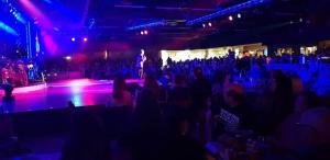 a crowd of people watching a woman on a stage at Cosy caravans Meadow lake Golden Palm Resort in Chapel Saint Leonards +17 photos