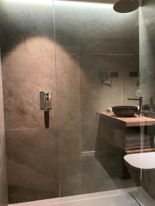 a bathroom with a glass shower with a sink at Baqueira321 Ubicación Privilegiada. in Baqueira-Beret +7 photos