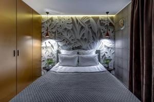 Katil atau katil-katil dalam bilik di Бутик-отель Графтио