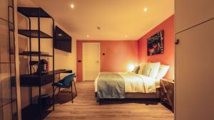 Postel nebo postele na pokoji v ubytování Oldschool Hotel