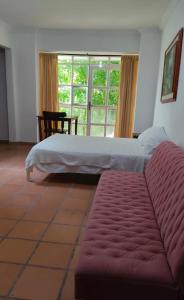 A bed or beds in a room at Cecil Aparta Estudios