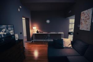 a living room with a couch and a table at Villa Calipso in Mondello