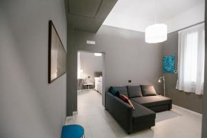 a living room with a couch and a chair at Villa Calipso in Mondello