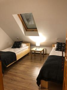 Posteľ alebo postele v izbe v ubytovaní DW Basia pokoje i apartament