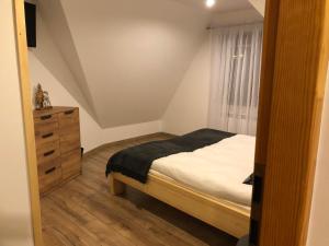 Posteľ alebo postele v izbe v ubytovaní DW Basia pokoje i apartament