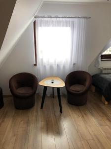 Posedenie v ubytovaní DW Basia pokoje i apartament