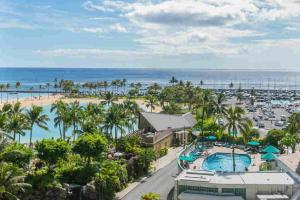 an aerial view of a resort with a pool and a beach at Ilikai Tower 720 Lagoon View 1BR in Honolulu