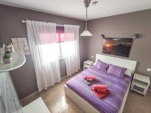 Posteľ alebo postele v izbe v ubytovaní VolKKanrentals Casa Chinijo