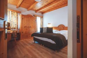 Postel nebo postele na pokoji v ubytování Hotel San Giacomo Spa&Gourmet