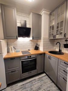 Kuchyň nebo kuchyňský kout v ubytování Nika Apartments