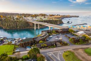 an aerial view of a harbor with a bridge at Harbor Lite Lodge in Fort Bragg