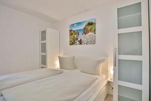 เตียงในห้องที่ Strandresidenz Timmendorfer Strand Strandresidenz Appartement 108 +17 ภาพ
