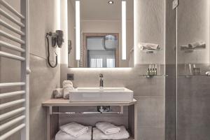 a bathroom with a sink and a mirror at Wieslbauer in Flachau