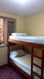 Ένα ή περισσότερα κρεβάτια σε δωμάτιο στο La Casa de Pedro Hostel