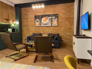 TV a/nebo společenská místnost v ubytování Alpic Redco New Gudauri Apartment 305
