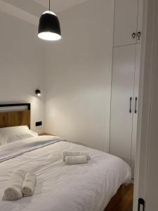 Postel nebo postele na pokoji v ubytování Alpic Redco New Gudauri Apartment 305