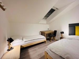 Postel nebo postele na pokoji v ubytování Apartmány Panorama Harrachov