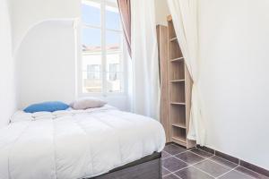 a bedroom with a bed and a book shelf at IMMOGROOM - Center - Modern - 10 min from Palais des Festivals in Cannes